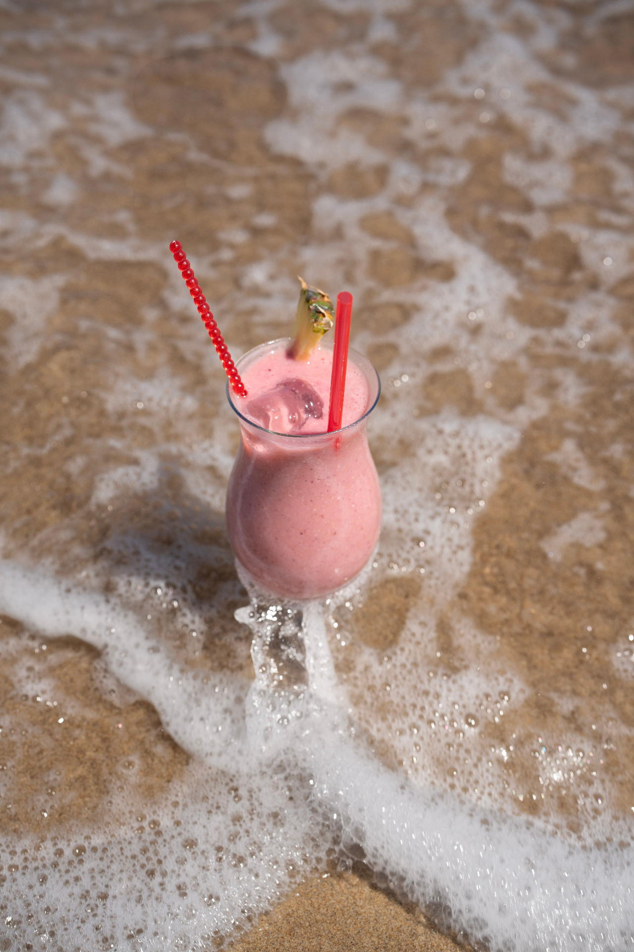 Pink smoothie at the water's edge