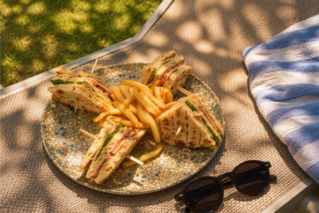 Club sandwich platter on a sunbed