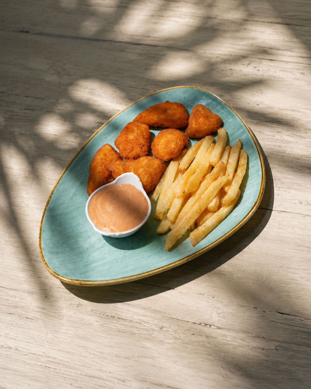 Chicken nuggets and fries with dip